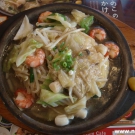 Soup ramen with bamboo outgrowth and shrimps.