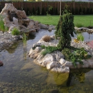 Pond with small island from travertine in Poprad.
